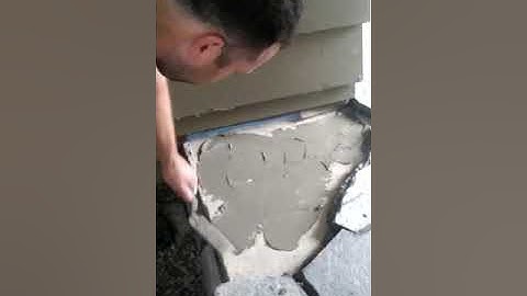 demonstrating how to cut flagstone using a wire tracer , Edifice Masonry