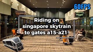 Riding on singapore skytrain to gates a15-a21 Riding on singapore skytrain to gates a15-a21