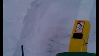 John Deere 316 with 49 Snowthrower in a large snowdrift