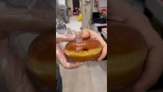 Filling donut with raspberry