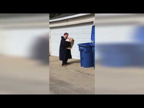 Man Flattening Cardboard