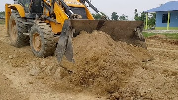 JCB Backhoe Machine Working For Village Road Construction-Leveling Mud in Road-Road Construction.