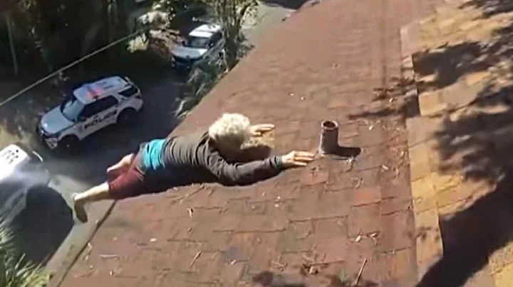 Officers Rescue Elderly Man Hanging On For Dear Life From Roof