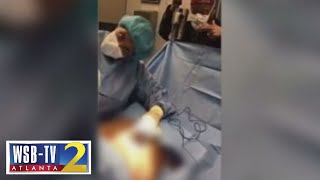 Woman says dancing doctor left her disfigured while making music video during surgery | WSB-TV