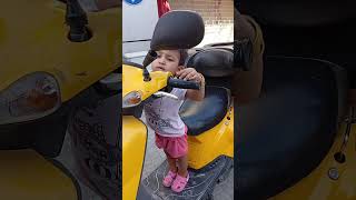 Baby Asfy Playing On The Motorcycle
