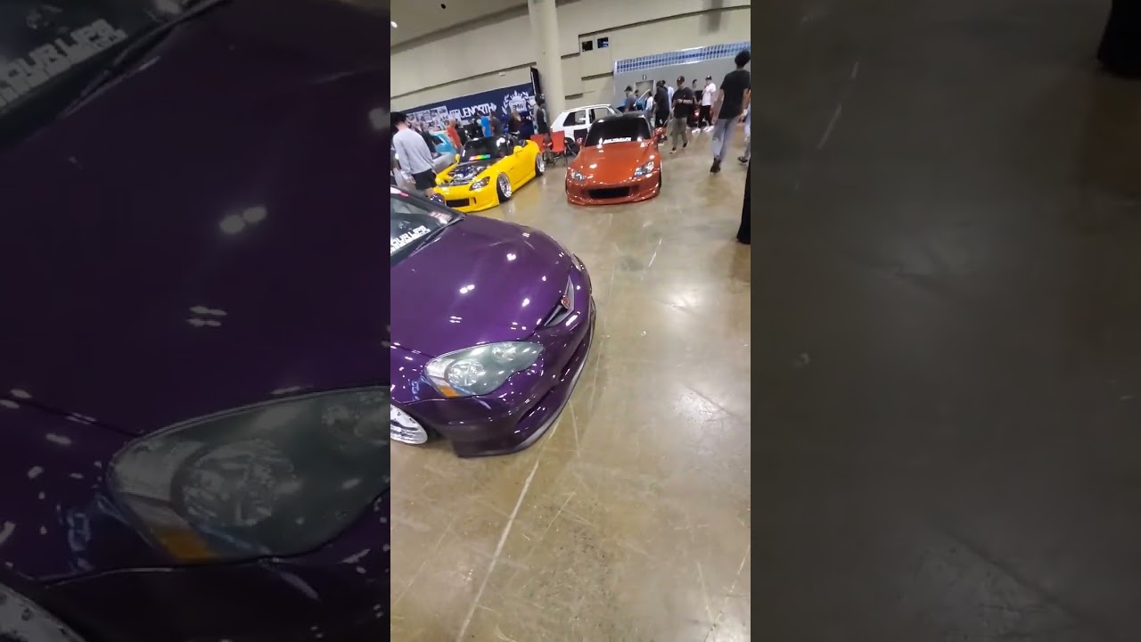 An Acura rsx with a (H) Honda emblem on it.