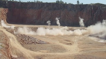Bench blasting in a limestone quarry
