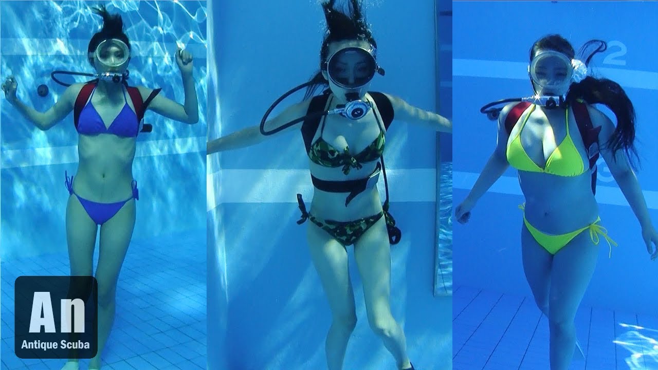 antique scuba angels in pool