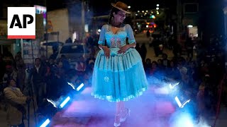 Indigenous Cholita women in Bolivia showcase their traditional dresses