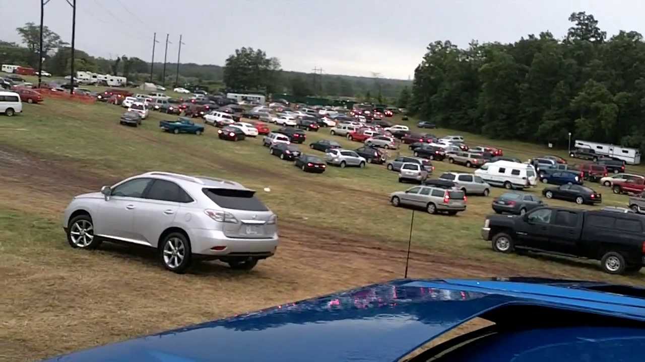 Cars stuck in a muddy field - YouTube