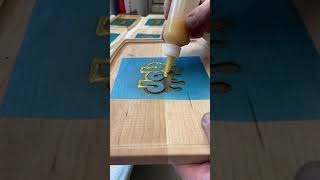 Adding colored resin to hand made rolling trays