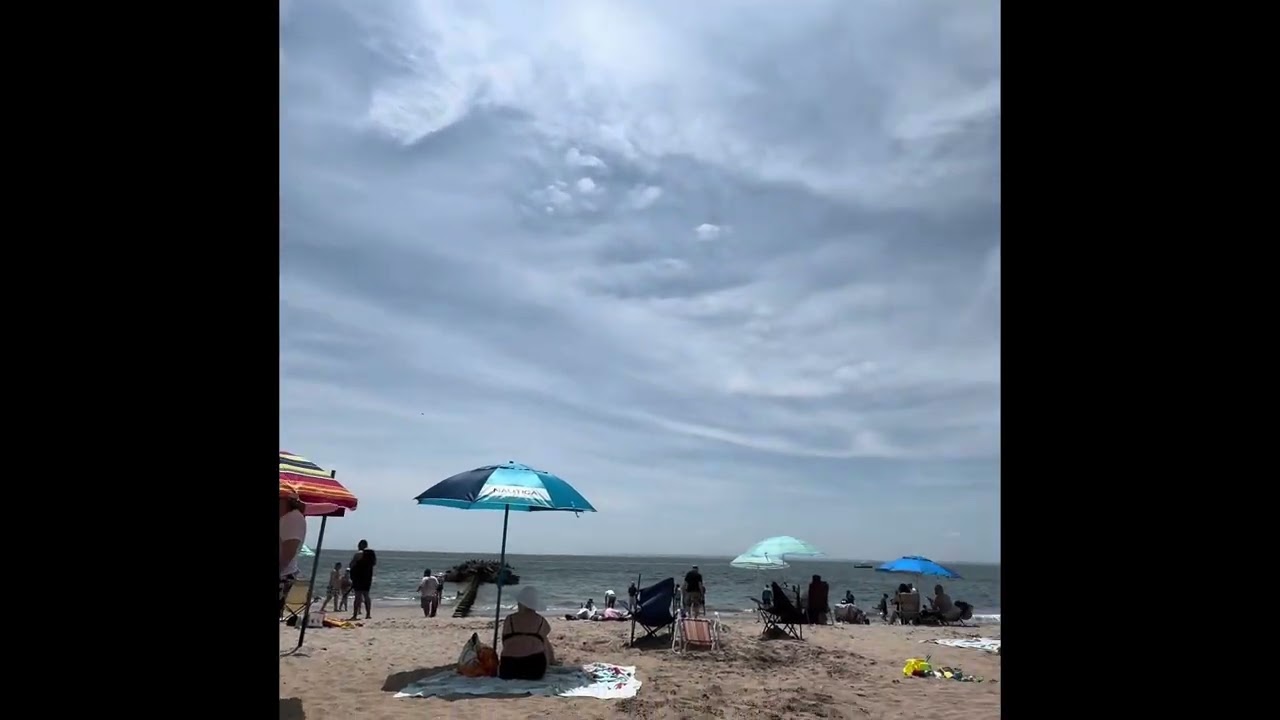 I relax in a Wolf Wise Beach Tent at Coney Island in NYC
