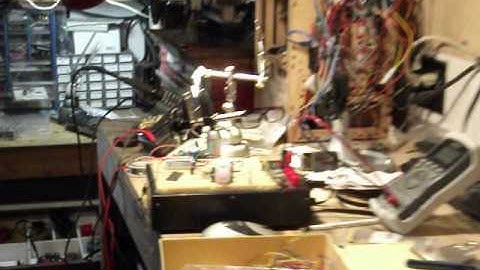 Parallax PIR sensor and Radio Shack voice recorder.