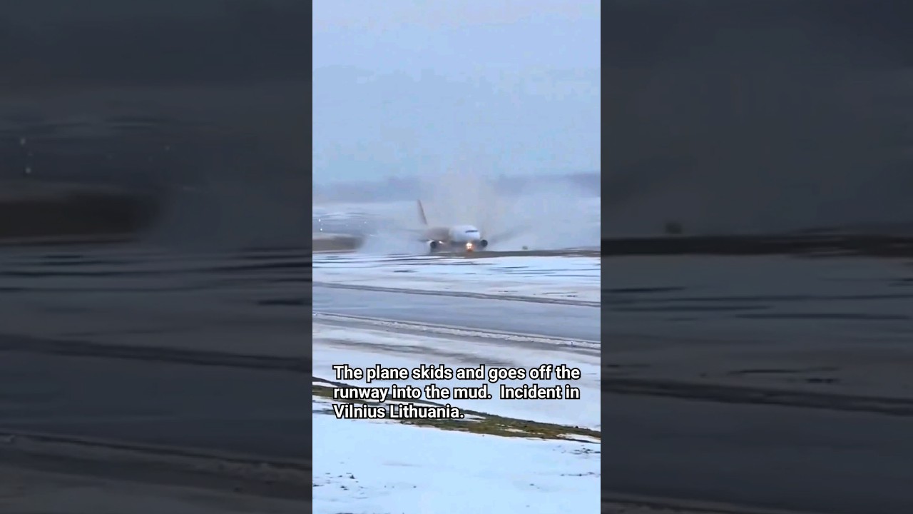 The plane skids and goes off the runway into the mud.  Incident in Vilnius Lithuania.