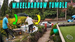 Man Takes a Tumble While Pushing Wheelbarrow