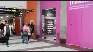 Man Walks Into Picture Of Store In The Mall