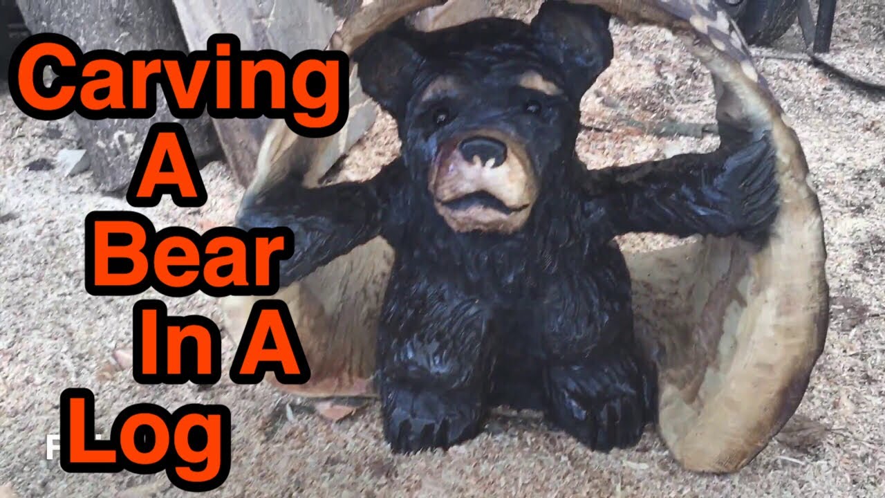 Chainsaw carving a bear in a log - YouTube