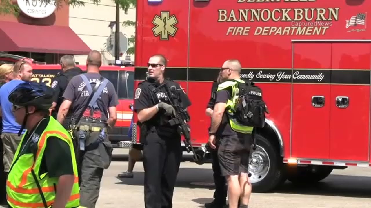 Gunman at large after killing at least five at Chicago-area parade