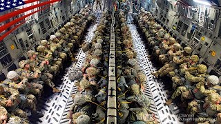 飛行機からパラシュートで真っ暗な地上に飛び降りる空挺隊員たち：夕方