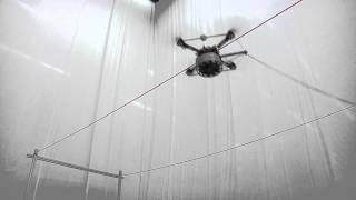 Building Tensile Structures with Flying Machines