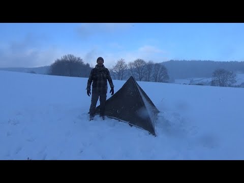 Setting up a tarp in the storm