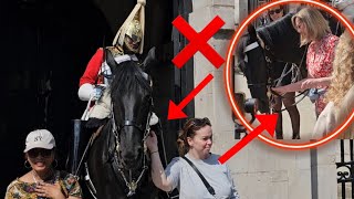 King's Guards Bends Over to Get a Better View as Two Lady Touches the Reins!