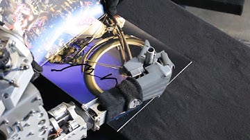 Robot Mega-Wattson signing albums for the Meatbags