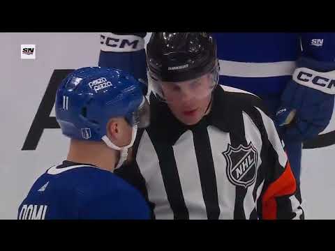 Max Domi and Jeremy Swayman collide during the TV timeout