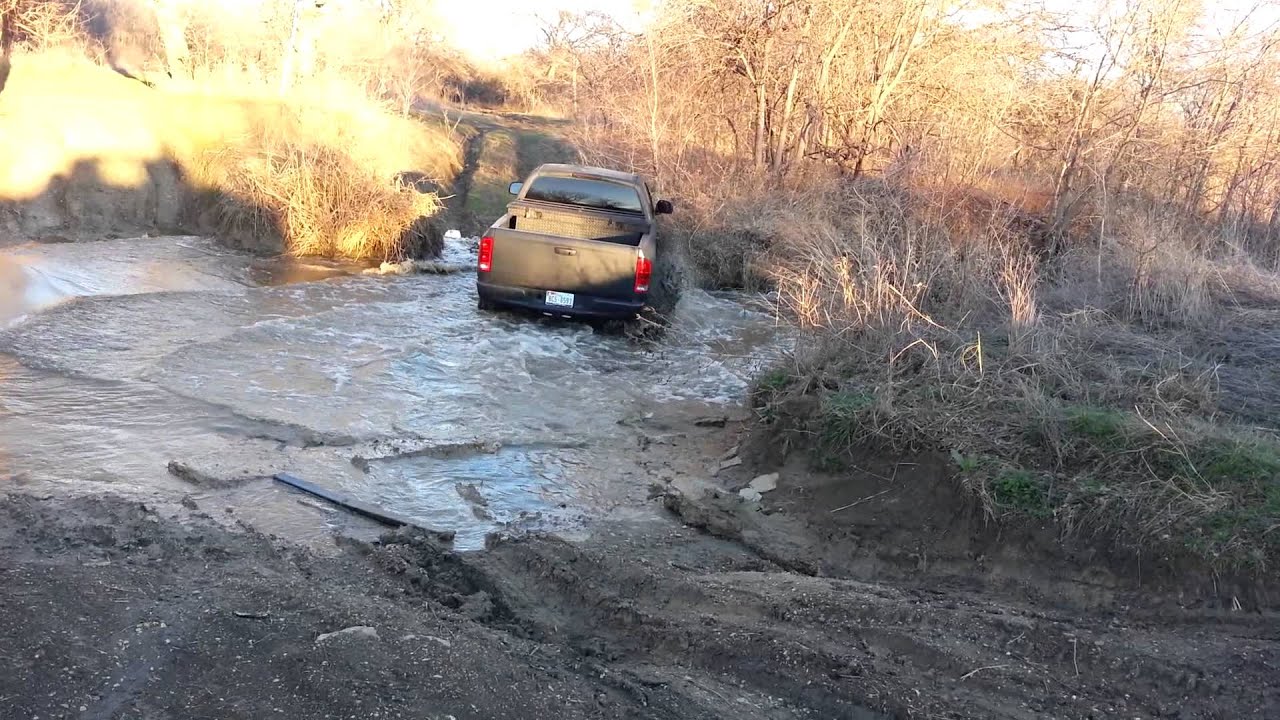 Dodge ram crossing muddy creek stuck