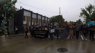 Protesters march silently through Seattle streets