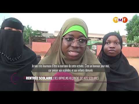 TM1 News - BACK TO SCHOOL: Orphans receive school supplies.