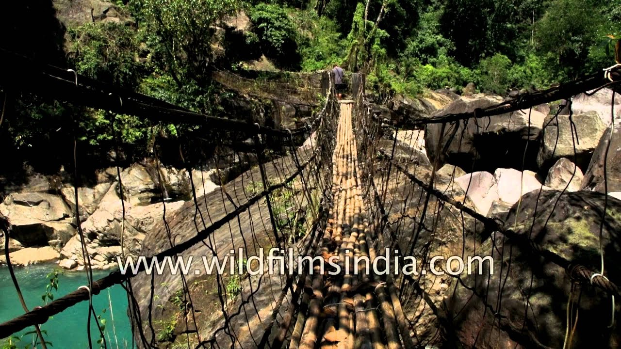 Walking on rusty iron cable bridge in  Cherrapunjee