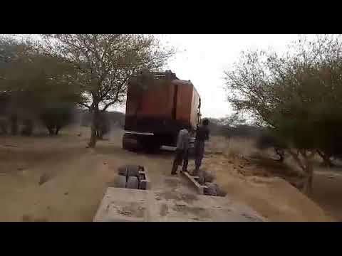 Excavator loading Lowboy Trailer