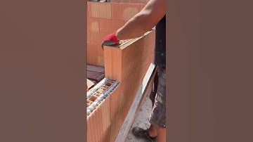 the process of installing large red bricks #shorts