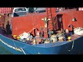 Tugboats With Container Ship Upclose