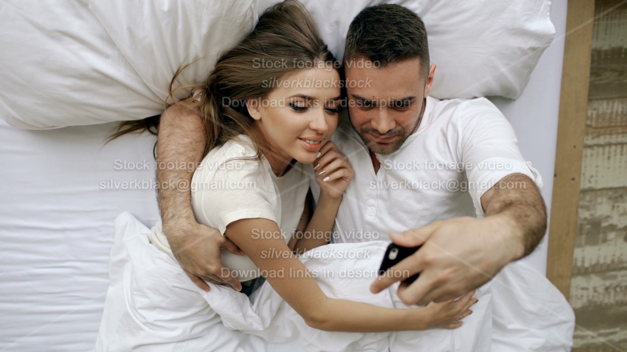 Young Beautiful And Loving Couple Take Selfie Picture On Smartphone