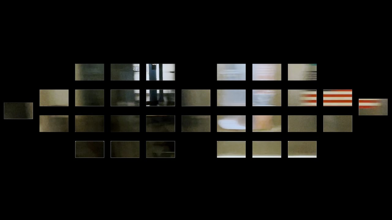 In the Swarm, a 32 channel video installation is structure in front and 6 screens with shot of green trees in a rainstorm, and the remaining 26 screens with shot of rain falling on the ground. The background is black, surrounded by speakers.