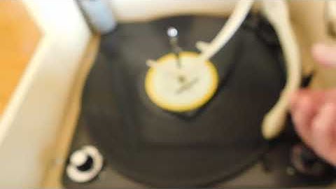 Zenith Cobra-Matic 4 speed automatic record player playing an LP record.