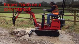 AXPAN AX36PRO with Ripper Tooth at work on a concrete slab