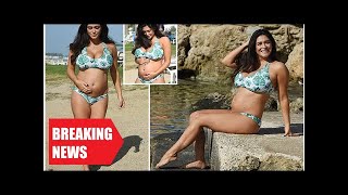 Breaking News - Casey batchelor shows off her baby bump in a palm print bikini as she sunbathes in