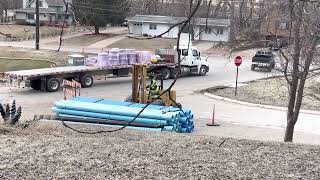 Water Main Pipes are getting Delivered. Road Construction Project.