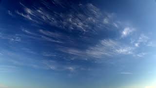 Wispy Clouds Drifting Across Deep Blue Sky | Premium Video Footage | 4K