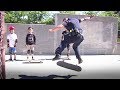 Police officer skateboards with kids