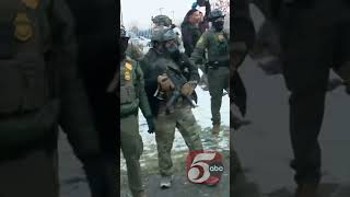 Protestors and federal agents clash outside Whipple Building
