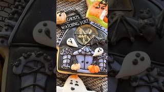 Haunted House Sugar Cookie With A Flying Ghost Inside.