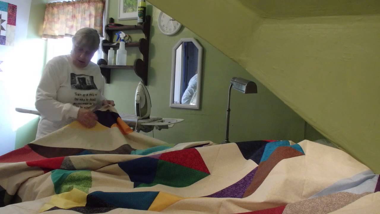 Sewing the top, batting and back together... YouTube