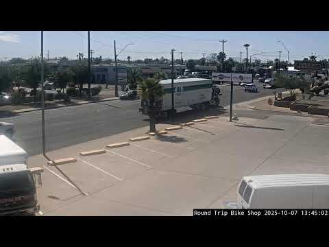 Parking in front of Round Trip Bike Shop Live Stream