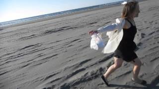 blouse rippling in the wind on the beach