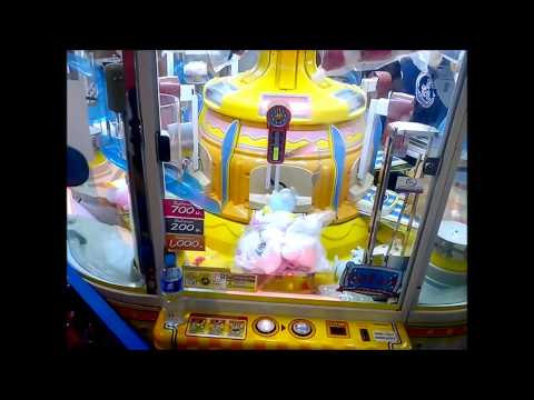 Asian Pro Plays Toy Grabbing Game