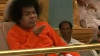 Vibhuti for everyone - Sai Baba materializing Vibhuti  blowing it towards devotees and students